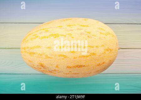 single melon on wood background Stock Photo