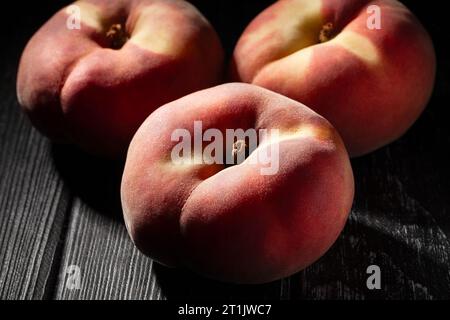 flat peach on wood background Stock Photo
