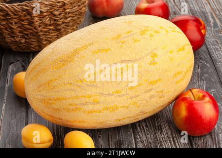 single melon on wood background Stock Photo