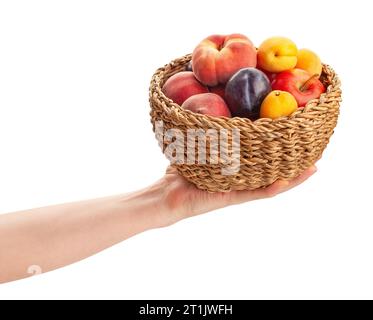 fruit mix basket in hand path isolated on white Stock Photo