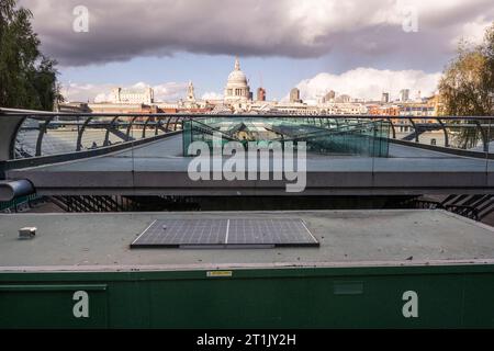 London, UK.  14 October 2023.  The Millennium Bridge is devoid of pedestrians as it has closed for maintenance.  City Bridge Foundation, a charity that looks after London's major Thames crossings, says that a layer of membrane has started to degrade and needs replacing.  Repairs will take three weeks.  Credit: Stephen Chung / Alamy Live News Stock Photo