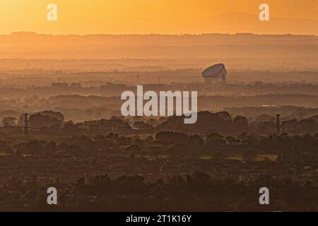 The Lovell Telescope at Jodrell Bank on the early evening light as seen from Macclesfield in Cheshire. Stock Photo