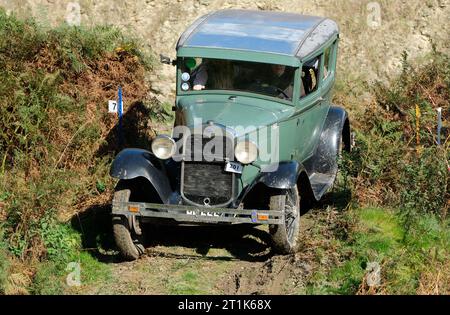 Badlands Farm, Kinnerton, Powys, Wales, UK – Saturday 14th October 2023 – Competitors drive a Ford Model A ( built 1930 ) over the difficult off road course of the Vintage Sports Car Club ( VSCC ) Welsh Trials in glorious autumn sunshine in Mid Wales. Photo Steven May / Alamy Live News Stock Photo