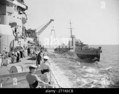 On Board the Battleship HMS Warspite. 3 July 1943, in the Sicilian Narrows, En Route From Gibraltar To Alexandria. HMS WARSPITE oiling the destroyer RAIDER during the passage through the Sicilian Narrows. Stock Photo