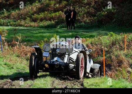 Badlands Farm, Kinnerton, Powys, Wales, UK – Saturday 14th October 2023 – Competitors drive a Riley 9 Tourer Special ( built 1930 ) over the difficult off road course of the Vintage Sports Car Club ( VSCC ) Welsh Trials in glorious autumn sunshine in Mid Wales. Photo Steven May / Alamy Live News Stock Photo