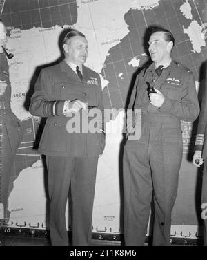 Royal Air Force Coastal Command, 1939-1945. The Air Officer Commanding-in-Chief of Coastal Command, Air Chief Marshal Sir Sholto Douglas (left), standing with his Senior Air Staff Officer, Air Vice-Marsal A B Ellwood, in Operations Room at Coastal Command Headquarters, Eastbury Park, Northwood, Middlesex, on the morning of the Normandy invasion. Stock Photo
