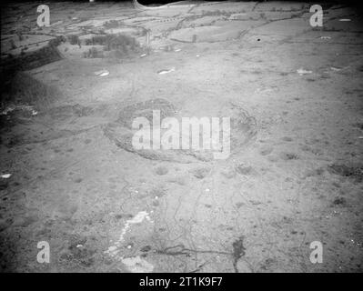 Royal Air Force Maintenance Command, 1939-1945. Oblique aerial view of the crater caused by the detonation of 3,500 tons of high explosive in the New High Explosive Bomb Area at No. 21 Maintenance Unit at Fauld, near Hanbury, Staffordshire, at 11.11 am on 27 November 1944. RAF Fauld, situated in a former gypsum mine, was the main repository of HE ordnance in the country. The explosion, calculated at some 4 kilotonnes, constitutes the world's largest non-nuclear explosion. 23 workers at the site, both RAF personnel and Italian prisoners of war, were killed, as were 41 workers at a nearby plaste Stock Photo