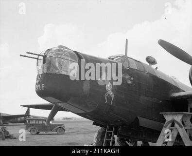 Royal Air Force Operations in the Middle East and North Africa, 1939-1943. The nose of Vickers Wellington B Mark III, (possibly HF482) 'JN-A' 'A for Apple', of No. 150 Squadron RAF at Blida, Algeria, showing a bomb tally indicating 16 completed missions, and nose artwork depicting Captain Reilly-ffoul, a villainous character in the 'Just Jake' cartoon strip by Bernard Graddon, which appeared in the Daily Mirror throughout the war. Stock Photo