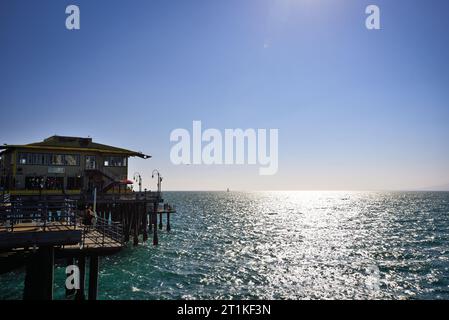 Sunset over the Pacific Ocean by Santa Monica Pier - Los Angeles, California Stock Photo