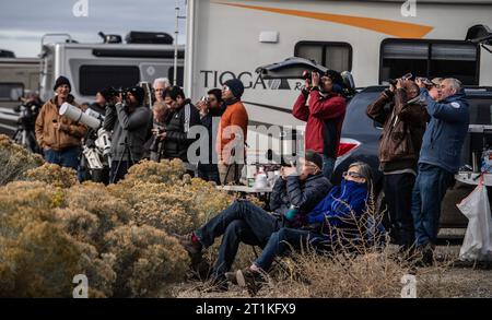 Winnemucca, United States. 14th Oct, 2023. Skywatchers make photographs as the 2023 annular eclipse peeks through the clouds over Winnemucca, Nevada on October 14, 2023. Heavy cloud cover limited the visibility of the eveny. Photo by Terry Schmitt/UPI Credit: UPI/Alamy Live News Stock Photo