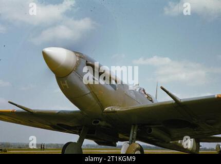 The Royal Air Force in Britain, May 1942 Flight Lieutenant Laurie of No 222 Squadron, Royal Air Force warming up Supermarine Spitfire Mark V, BM202 'ZD-H' 'Flying Scotsman', at North Weald, Essex. This aircraft was the second bearing this name to be paid for from donations made by LNER personnel, arranged through the company's wartime headquarters at Hitchin. Stock Photo