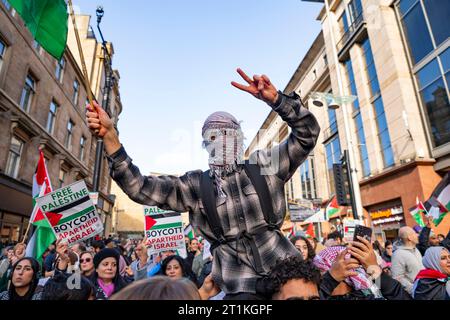 Glasgow, Scotland, UK. 14th October 2023.  Supporters of Palestine attend a rally and demonstration in Glasgow at the Buchanan  street steps today. They were protesting against the severe retaliation by Israel against Gaza following the Hamas attack  on Israel last week. After the rally the protesters marched through the city centre to the BBC studios at Pacific Quay where a rally against the BBC was held. Iain Masterton/Alamy Live News Stock Photo