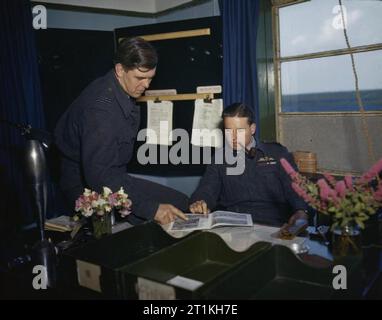 Wing Commander Guy Gibson, Vc, Dso and Bar, Dfc and Bar, Commander of 617 Squadron (dambusters) at Scampton, Lincolnshire, 22 July 1943 Wing Commander Guy Gibson at his desk with Squadron Leader D J H 'Dave' Maltby, one of his flight commanders. Stock Photo