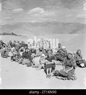 Evacuation of Polish Civilians From the Soviet Union To Persia, 1942 Group of Polish refugees, mostly women and children, resting on the long hard road over the mountains. Stock Photo