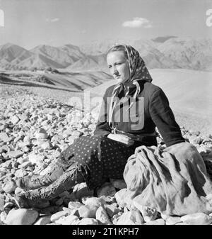 Evacuation of Polish Civilians From the Soviet Union To Persia, 1942 Grown up daughter of the Kowalski family resting during the journey on foot from the Soviet Union over the mountains into Persia. Stock Photo