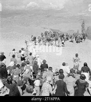 Evacuation of Polish Civilians From the Soviet Union To Persia, 1942 From the Polish refugee camp a party going out to meet new arrivals. They coming upon them as they top the last hill and both parties running towards each other. Stock Photo