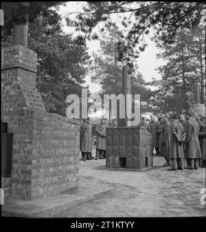 US Troops Attend British Army School- American Soldiers Train at the British Army School of Hygiene, UK, 1944 At the British Army School of Hygiene, a group of British and American soldiers inspect an incinerator, which has been constructed from empty tins filled with earth and other materials, showing that items such as the brick-built incinerator (visible in the foreground) can be adapted for use in the field, using any available materials. Stock Photo
