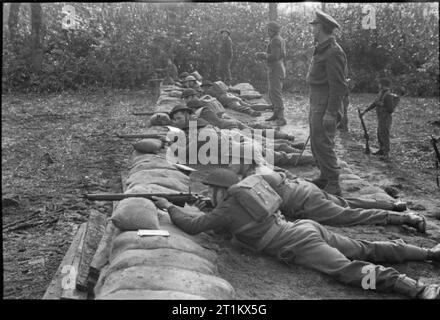 Belgian Commandos in Training, UK, 1945 Men of the 2nd Battalion, 2nd Belgian Brigade at shooting practice as part of their Commando training. The original caption states that they are using live ammunition at twenty yards. Stock Photo