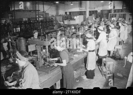 Birth of a Bomber- Aircraft Production in Britain, 1942 Women at work in the machine shop of the Handley Page aircraft factory at Cricklewood. Stock Photo