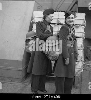 Americans in Britain, 1942 - 1945 Women in the United States Forces in Britain: Trouser-clad United States nurses preparing to come ashore after arriving in Northern Ireland. Stock Photo