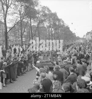 The British Army in North-west Europe 1944-45 Scenes of jubilation as British troops liberate Brussels, 4 September 1944. A carrier crewed by Free Belgian troops is welcomed by cheering civilians. Stock Photo