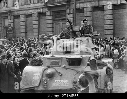 The British Army in North-west Europe 1944-45 Scenes of jubilation as British troops liberate Brussels, 4 September 1944. Lt Col H A Smith, CO of 2nd Household Cavalry Regiment, arrives in his Staghound armoured car. Stock Photo