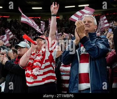 Wigan Warriors fans cheer on their side during the Betfred Super League Grand Final match Wigan Warriors vs Catalans Dragons at Old Trafford, Manchester, United Kingdom, 14th October 2023  (Photo by Steve Flynn/News Images) Stock Photo