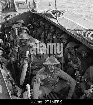 The British Army the Middle East 1941 Camouflaged troops in an assault landing craft during combined operations training in the canal zone, Egypt, 2 August 1941. Stock Photo