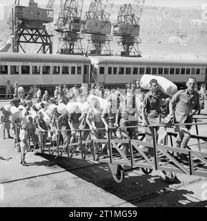 Ex-prisoners of war and civilian internees from Singapore travel aboard ...