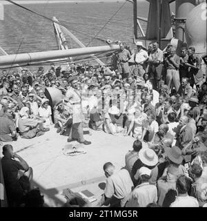 Ex-prisoners of war and civilian internees returning from Singapore sew ...