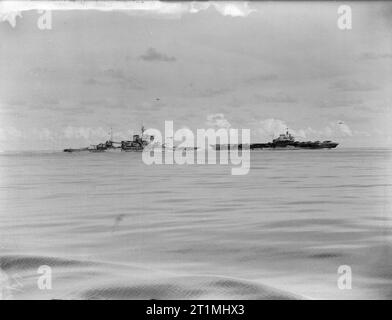 Ships of the Eastern Fleet. August 1942, on Board HMS Mauritius. HMS WARSPITE, battleship, and HMS ILLUSTRIOUS, aircraft carrier. Stock Photo