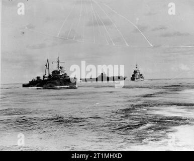 Ships of the Eastern Fleet. August 1942, on Board HMS Mauritius. Left to right: Dutch cruiser HEEMSKERK, aircraft carrier HMS ILLUSTRIOUS, and the battleship HMS WARSPITE. Stock Photo