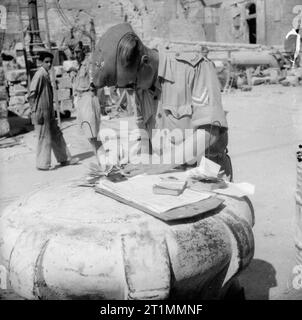 Operation Pedestal, August 1942 Operation Ceres: The unloading of supplies at Malta: A corporal checks supplies on the quayside. Stock Photo