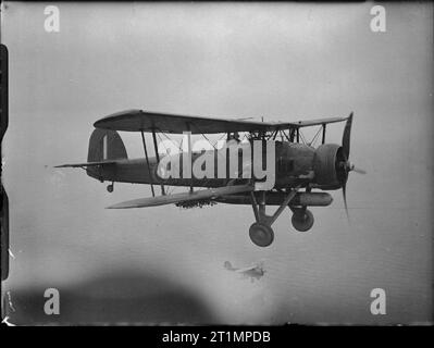 The Royal Navy during the Second World War No 785 Squadron, Fleet Air Arm: Fairey Swordfish Mk I Naval torpedo aircraft during a training flight from Royal Naval Air Station Crail. Stock Photo