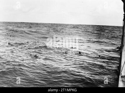 Free French Navy Ship Aconit Sinks U-boats, at Sea. Survivors of the 2nd German U-boat swimming towards FFS ACONIT after she had sunk their U-boat. Stock Photo