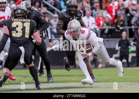 West Lafayette, Indiana, USA. 14th Oct, 2023. Ohio State Buckeyes quarterback Kyle McCord (6) carries the ball during the game between the Ohio State Buckeyes and the Purdue Boilermakers at Ross-Ade Stadium, West Lafayette, Indiana. (Credit Image: © Scott Stuart/ZUMA Press Wire) EDITORIAL USAGE ONLY! Not for Commercial USAGE! Stock Photo