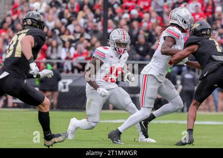 West Lafayette, Indiana, USA. 14th Oct, 2023. Ohio State Buckeyes running back Chip Trayanum (19) carries the ball during the game between the Ohio State Buckeyes and the Purdue Boilermakers at Ross-Ade Stadium, West Lafayette, Indiana. (Credit Image: © Scott Stuart/ZUMA Press Wire) EDITORIAL USAGE ONLY! Not for Commercial USAGE! Stock Photo