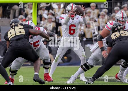 West Lafayette, Indiana, USA. 14th Oct, 2023. Ohio State Buckeyes quarterback Kyle McCord (6) takes the snap during the game between the Ohio State Buckeyes and the Purdue Boilermakers at Ross-Ade Stadium, West Lafayette, Indiana. (Credit Image: © Scott Stuart/ZUMA Press Wire) EDITORIAL USAGE ONLY! Not for Commercial USAGE! Stock Photo
