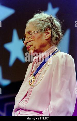 Civil Rights activist Rosa Parks wearing her Medal of Freedom as she is introduced to the audience by U.S. President Bill Clinton at the 26th annual Congressional Black Caucus gala dinner, September 14,1996 in Washington, D.C. The event honored the civil rights legend  40-years after she refused to move from a whites-only section on a Montgomery City Bus. Stock Photo