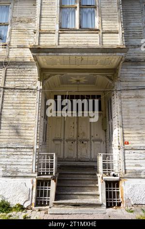 Old white color wooden entrance door of house in Turkey Istanbul Buyukada Stock Photo