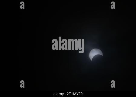 Bedford, USA. 14th Oct, 2023. BEDFORD, INDIANA - OCTOBER 14: A partial solar eclipse is seen through clouds in Lawrence County on October 14, 2023 in Bedford, Indiana. ( Credit: Jeremy Hogan/Ģ����ý Live News Stock Photo