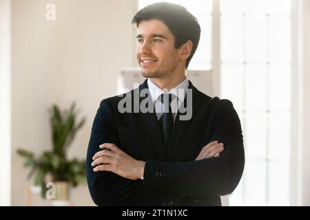 Happy handsome young business coach man posing in boardroom Stock Photo