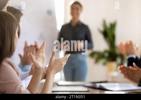 Inspired motivated business audience applauding coach after successful presentation Stock Photo