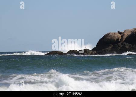 Waves breaking over rocks at a Good Harbor Beach in Gloucester on the North Shore, Massachusetts Stock Photo