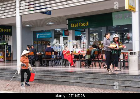 Travelers Enjoying Refreshments at Roadside Rest Stop between Hanoi and Lao Cai, Vietnam. Stock Photo