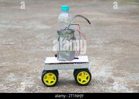 Fire fighting demo robot car for small applications. Robot car that has a bottle for carrying the liquid Stock Photo