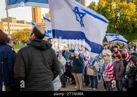 St. Paul, Minnesota.  People of all ages gather at the state capitol to show support for Israel and calling for the end of terrorism.  Group listening Stock Photo