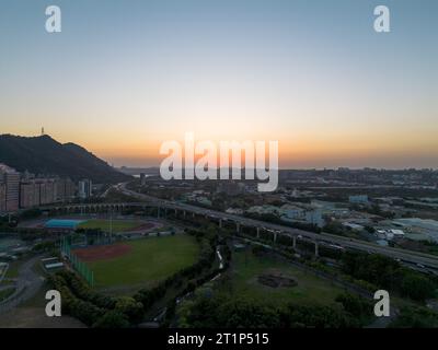 Aerial view of Sanxia District with cars on highway during sunset in New Taipei City, Taiwan. Stock Photo