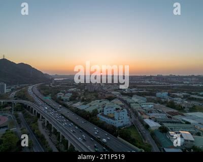 Aerial view of Sanxia District with cars on highway during sunset in New Taipei City, Taiwan. Stock Photo