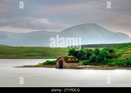 Loch Loyal is a freshwater lake located in the Assynt region of Sutherland, Scotland. Stock Photo